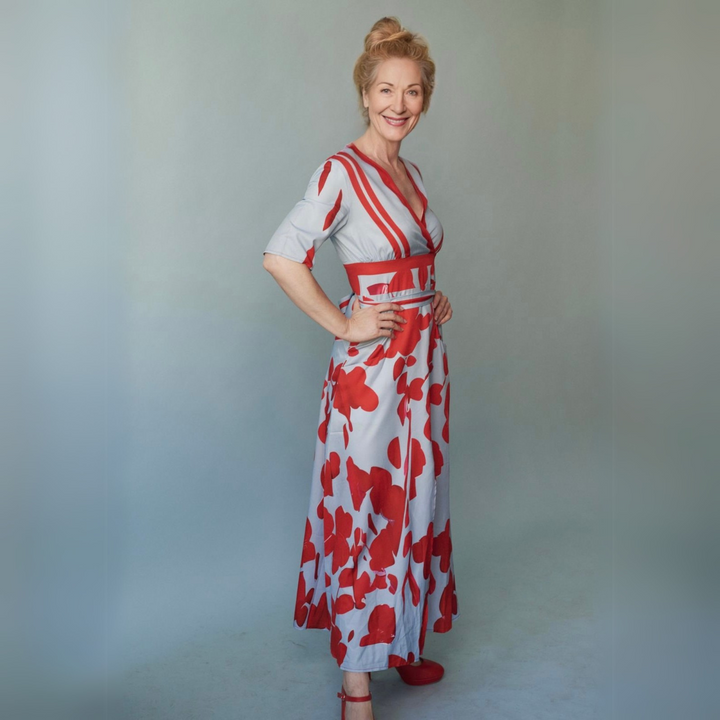 Effortless women's floral wrap maxi dress, ideal for summer vacations & elegant casual fashion. Printed with vibrant flowers.