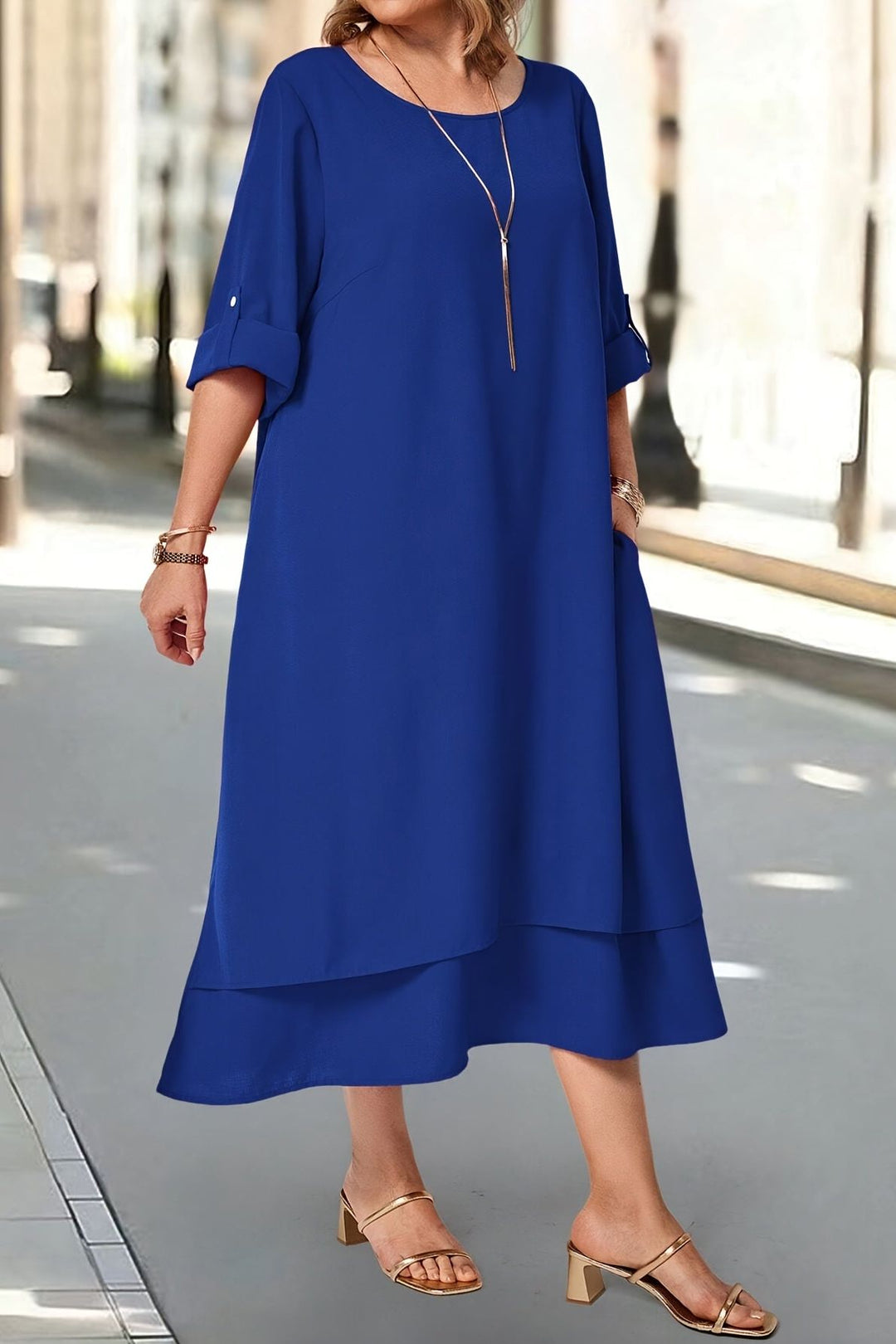 Elegant blue flowing long dress, a women's maxi gown for evening and party wear.