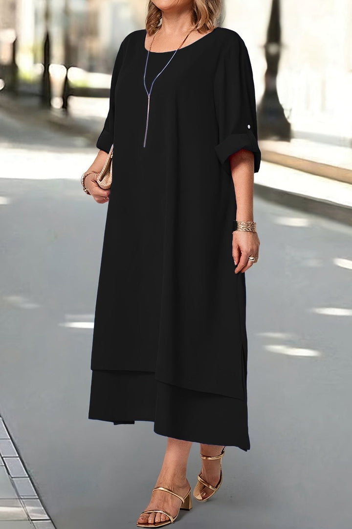 Black elegant women's maxi dress, a sophisticated flowing gown for formal occasions.