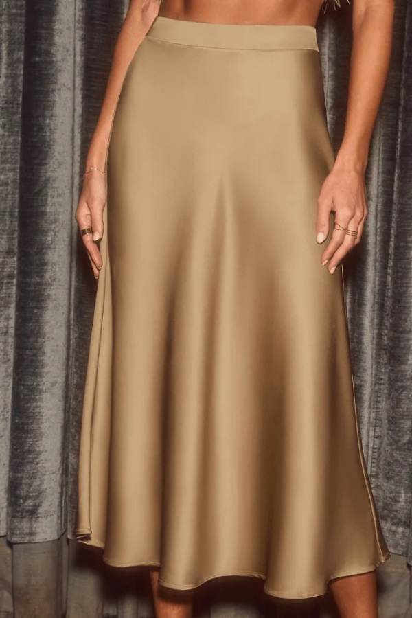 Elegant flowy A-line midi skirt for women. High-rise, versatile for office, casual, or evening wear.
