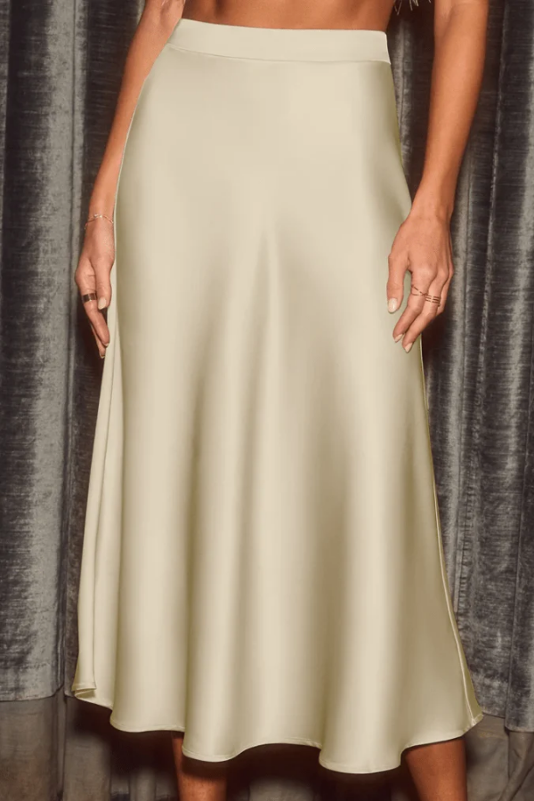 Flowy high-rise women's midi skirt, elegant A-line design. Fashionable and sophisticated for various occasions.