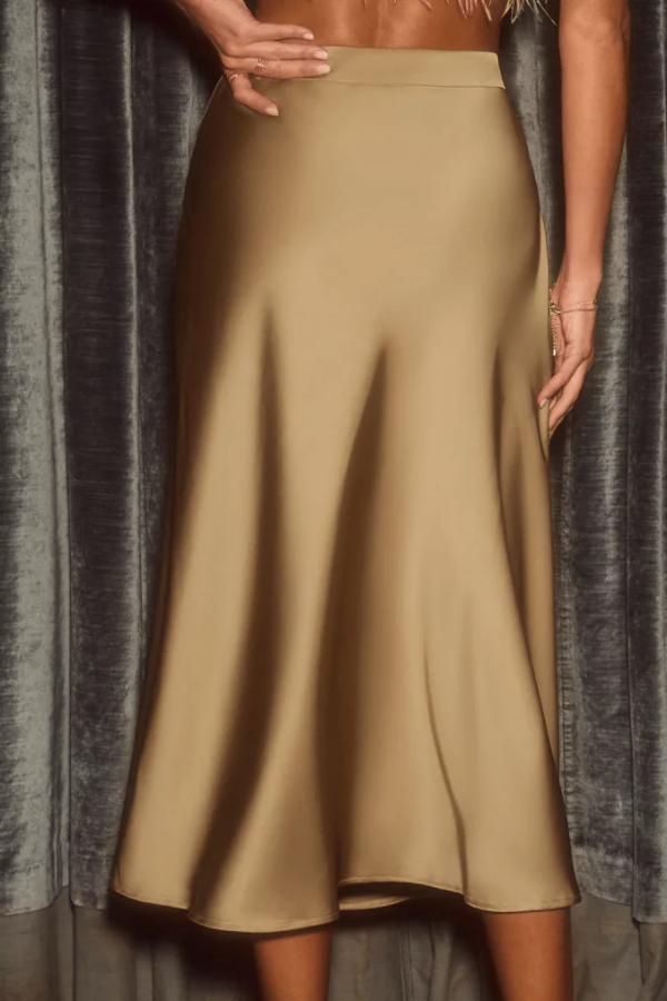 Comfortable & elegant high-rise midi skirt for women. Flowy A-line style, perfect for versatile everyday & evening wear.