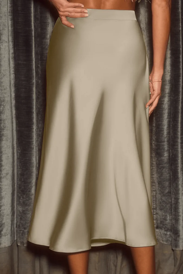 Fashionable women's elegant flow midi skirt. Flattering high-rise A-line cut, perfect versatile bottom for style.