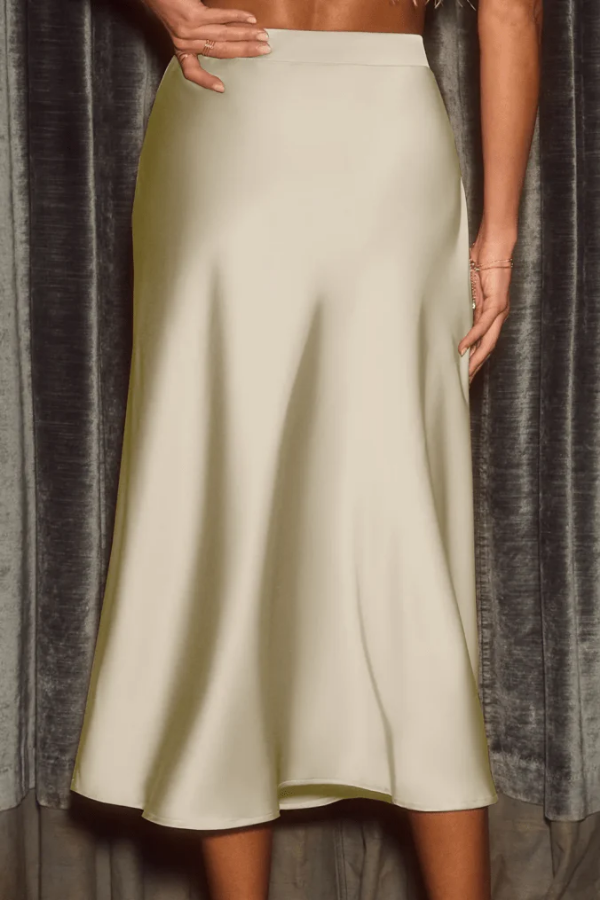 Women's elegant flow midi skirt, high-rise A-line design. Versatile and sophisticated for any everyday or evening look.