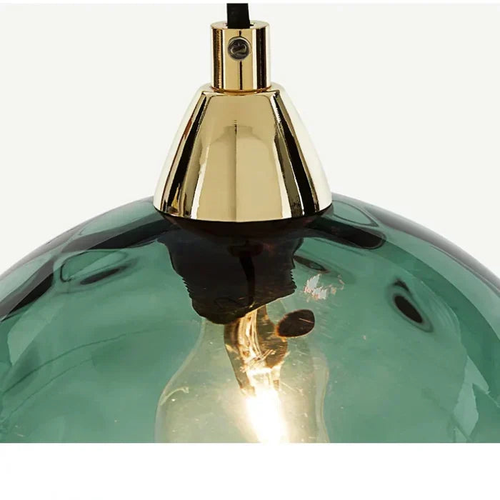 Stylish contemporary glass sphere pendant lamp, perfect decorative lighting for dining room.