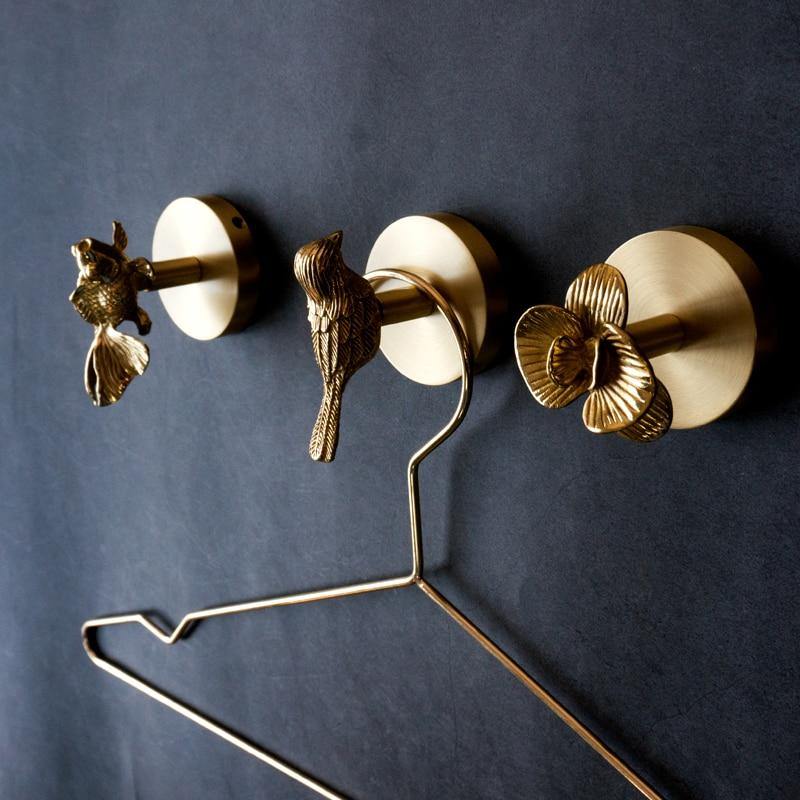 Unique decorative gold finish animal hook, perfect for entryway home decor.