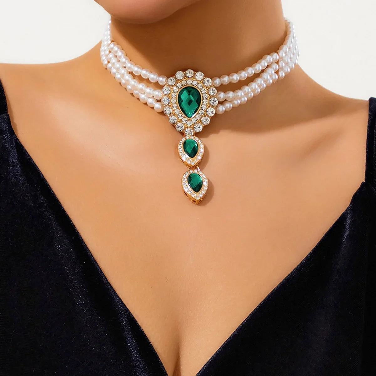 Chic women's gold jewelry set with a stunning necklace & bracelet, featuring elegant green and white stones.