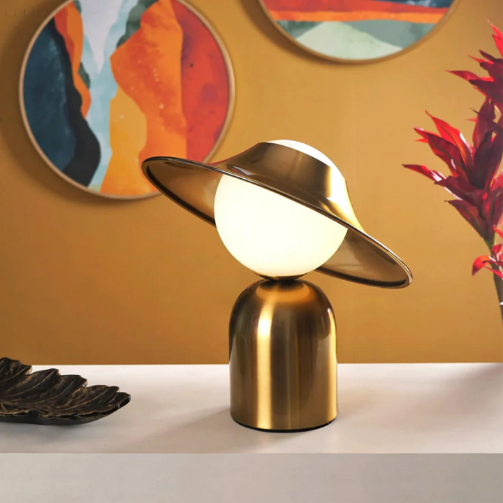 Elegant gold metal table lamp with sleek design, perfect for modern home decor in living rooms or bedrooms.