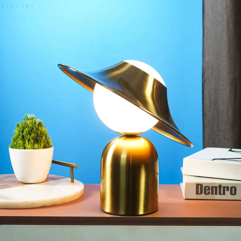 Modern gold metal desk lamp featuring a refined metallic finish, ideal for stylish home office or bedside tables.
