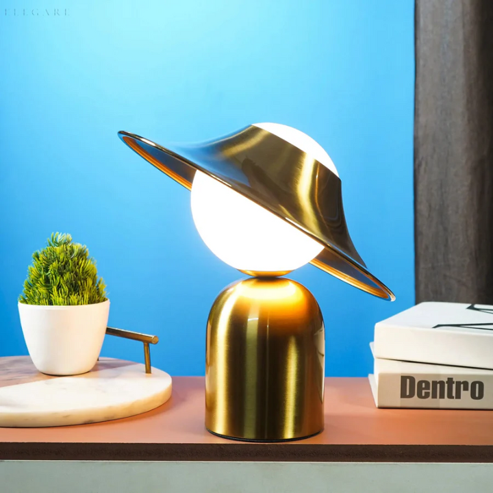 Modern gold metal desk lamp featuring a refined metallic finish, ideal for stylish home office or bedside tables.