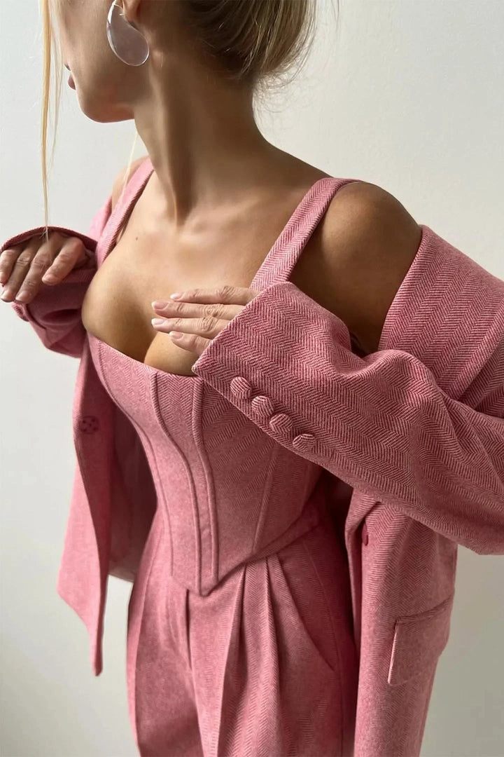 Versatile pink women's three-piece set: bustier, wide-leg pants & blazer, perfect for business chic.