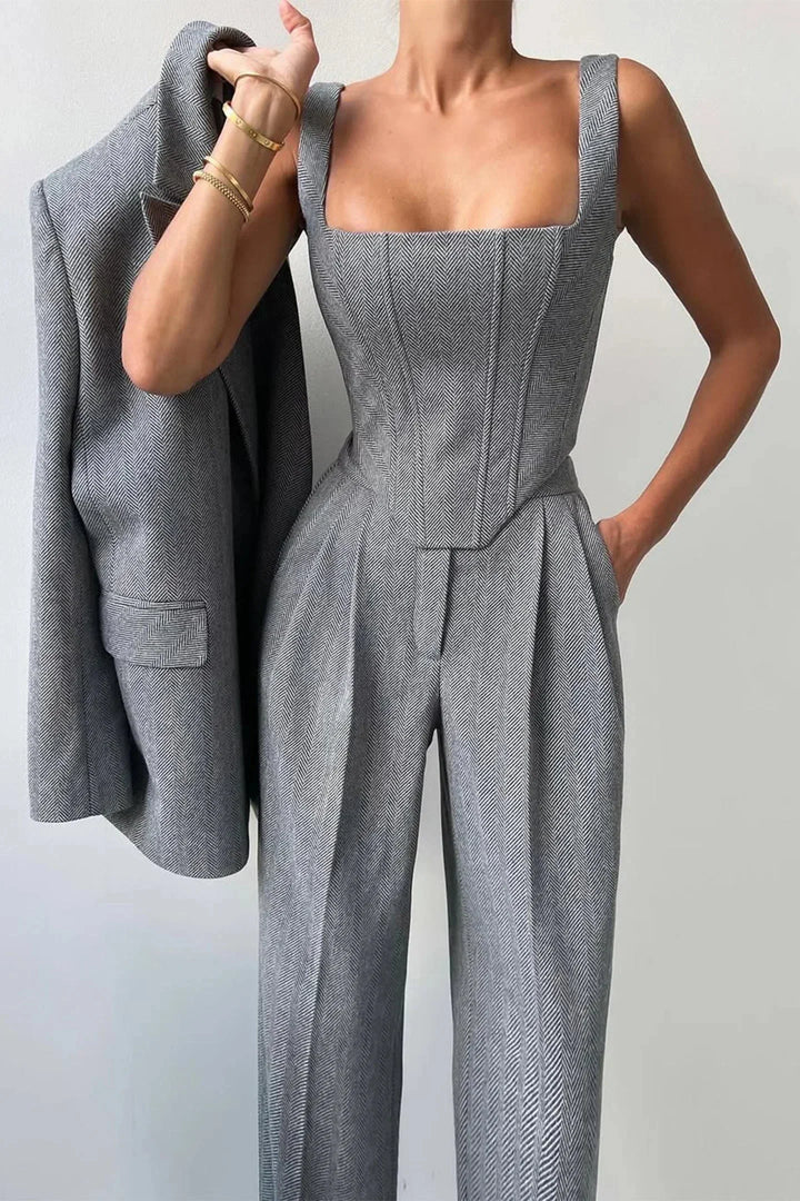 Women's power dressing gray corset bustier and wide-leg pants set, business chic.