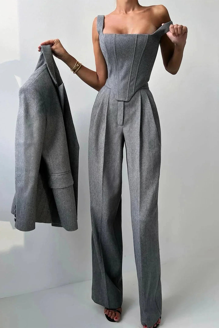 Stylish gray corset bustier top with wide-leg pants and oversized blazer, women's power suit.