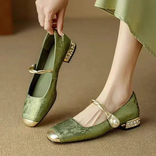 Elegant green square toe pumps for women, featuring a chic studded heel. Perfect for parties & evening wear.