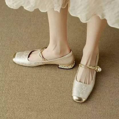 Full view of elegant women's square toe pumps with a striking studded heel, perfect for chic outfits.