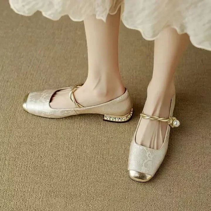 Full view of elegant women's square toe pumps with a striking studded heel, perfect for chic outfits.