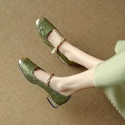 Women's elegant square toe pumps with a sophisticated studded heel, comfortable party heels.
