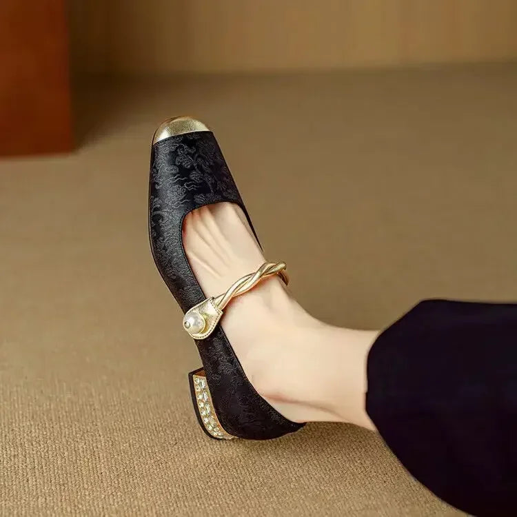 Close-up of the elegant studded heel on women's square toe pumps, highlighting intricate detail.