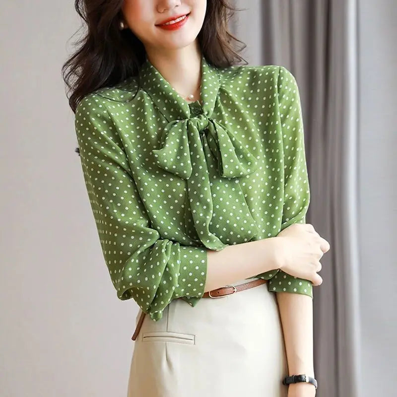 Elegant green women's long sleeve blouse with a chic bow-accent and sophisticated shawl collar.