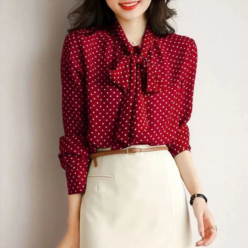 Apricot long sleeve women's shirt, an elegant top with a distinctive bow and sophisticated shawl collar.