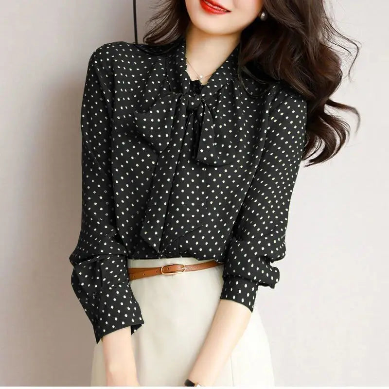 Black women's elegant bow-accent blouse, a versatile long sleeve shirt with a refined shawl collar.
