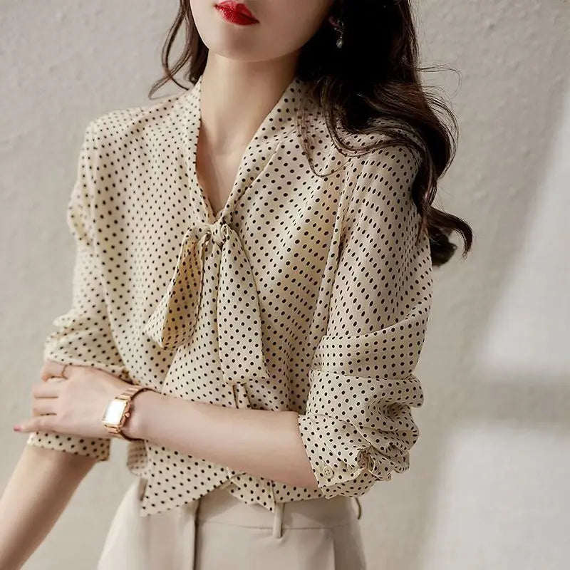 Green women's long sleeve top, an elegant blouse with a stylish bow-accent and sophisticated collar.