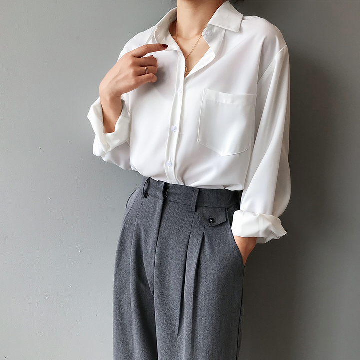 Chic women's high-low blouse with a flattering cut. Elegant long sleeve top, new in womenswear.
