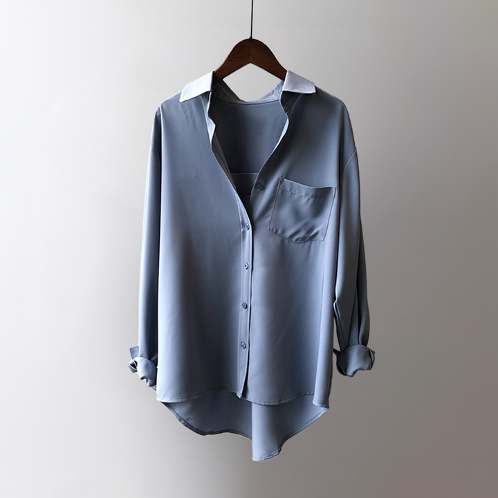 Fashionable high-low blouse for women. Elegant, flowy long sleeve top, ideal for stylish ensembles.