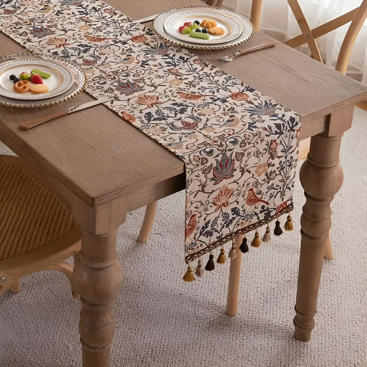Decorative floral bird motif table runner for elegant dining & coffee table decor.