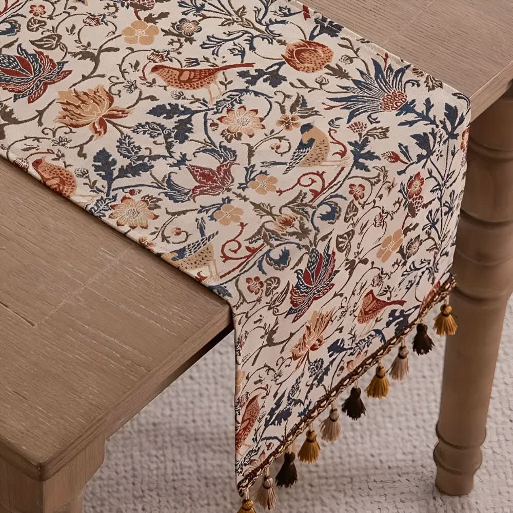 Fringed microfiber table runner, vintage elegance, with a detailed floral bird design.