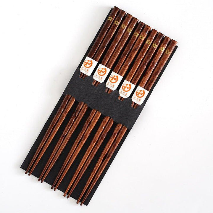 Premium wooden chopsticks set, 5 pairs, showcasing an elegant golden cherry blossom. Enhance your dining experience.
