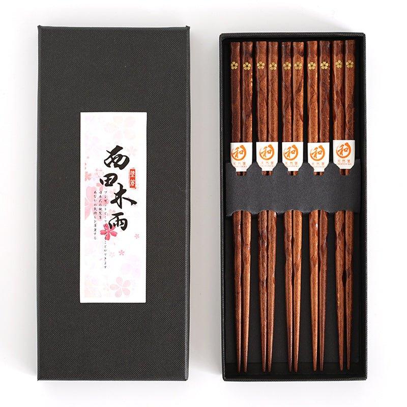 Golden cherry blossom wooden chopsticks set (5 pairs). Elegant Japanese tableware for dining and special occasions.