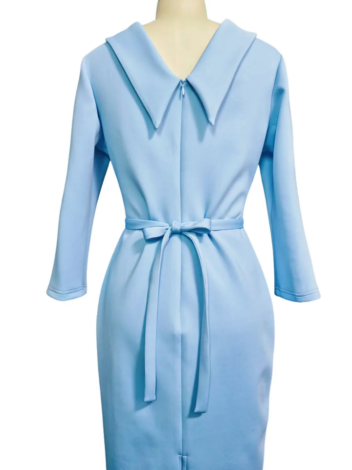Women's light blue midi work dress featuring a belted waist, elegant turn-down collar, and chic V-back design.