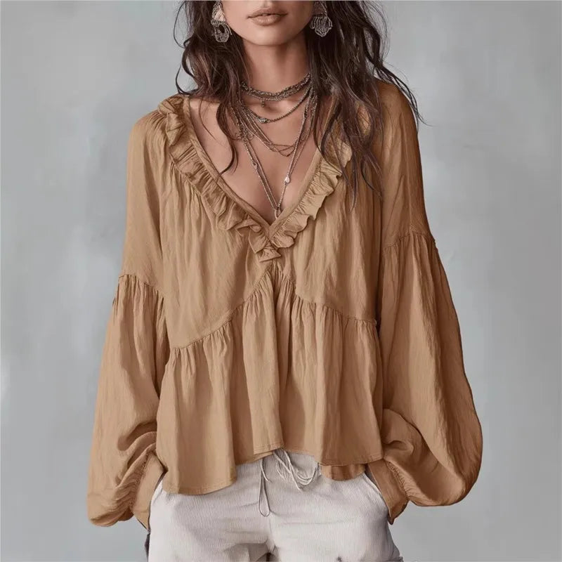 Elegant light brown women's ruffle blouse with deep V-neck and puff long sleeves. Perfect for spring fashion.