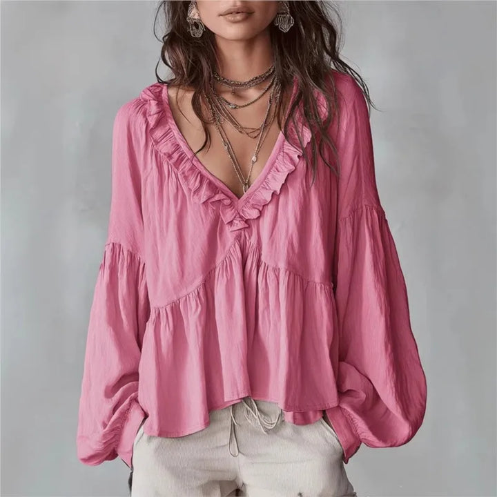 Pink elegant ruffle V-neck blouse for women. Features puff long sleeves, a relaxed fit. Great spring/summer wear.