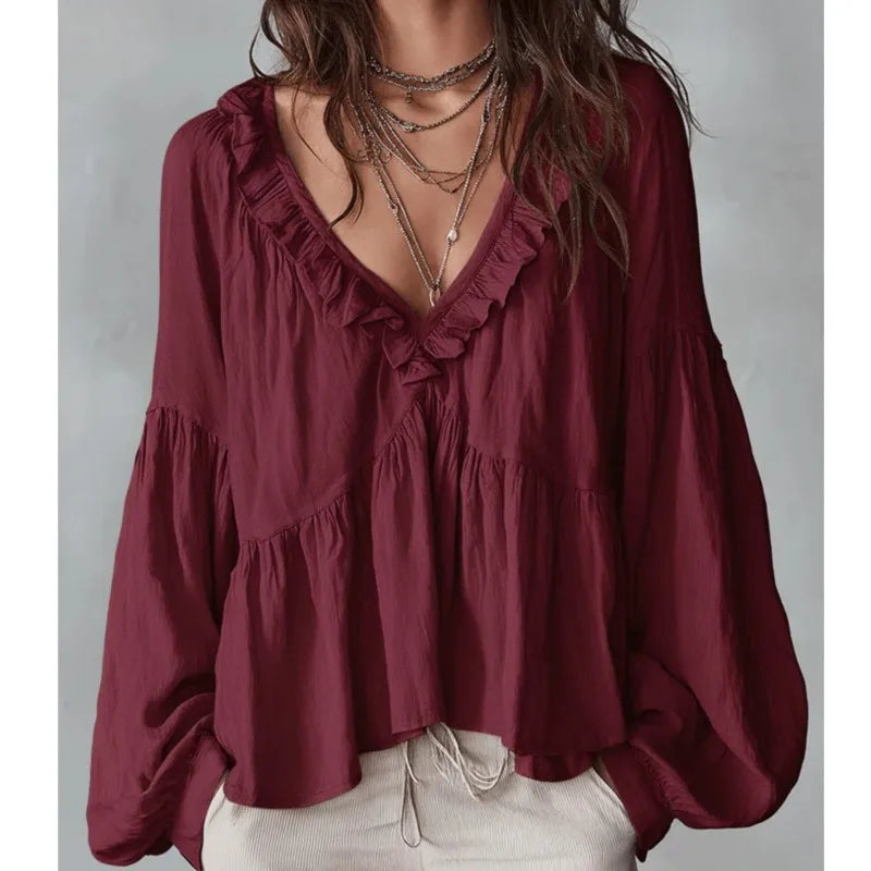 Red fashion women's deep V-neck ruffle blouse with long puff sleeves. Elegant and comfortable relaxed fit top.