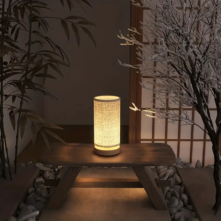 Decorative LinoGlow linen look night light, emitting a subtle glow. Ideal bedroom lamp with floral design.