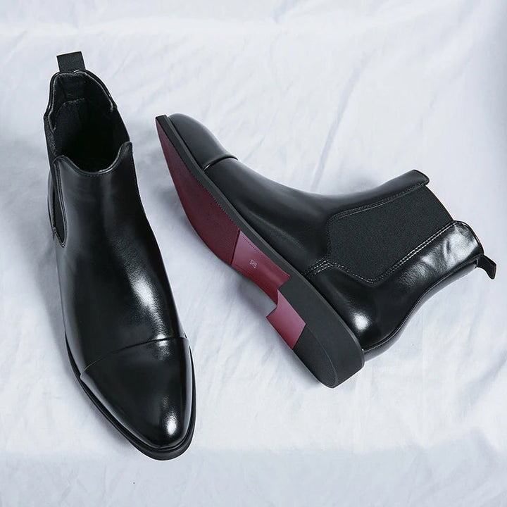 Elegant men's black slip-on ankle boots for modern style; comfortable & versatile dress footwear.
