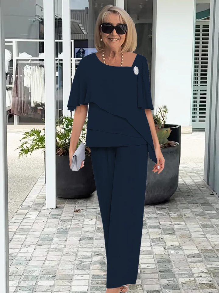 Women's comfortable navy blue overlay top and straight-leg pants set. Versatile for casual chic or formal wear.