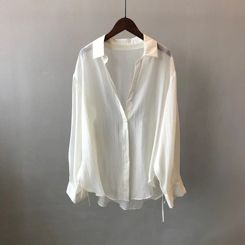 Elegant NOVA women's blouse, flowy fabric, perfect for versatile workwear or chic casual style.
