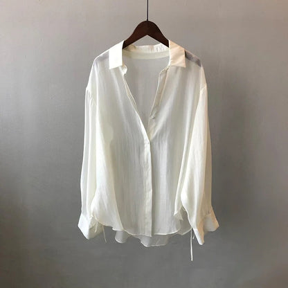 Elegant NOVA women's blouse, flowy fabric, perfect for versatile workwear or chic casual style.