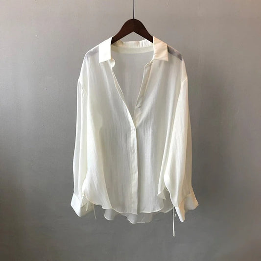 Elegant NOVA women's blouse, flowy fabric, perfect for versatile workwear or chic casual style.