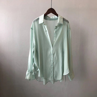 Chic NOVA ladies' blouse with a flowy design, elegant long sleeves, suitable for everyday fashion.