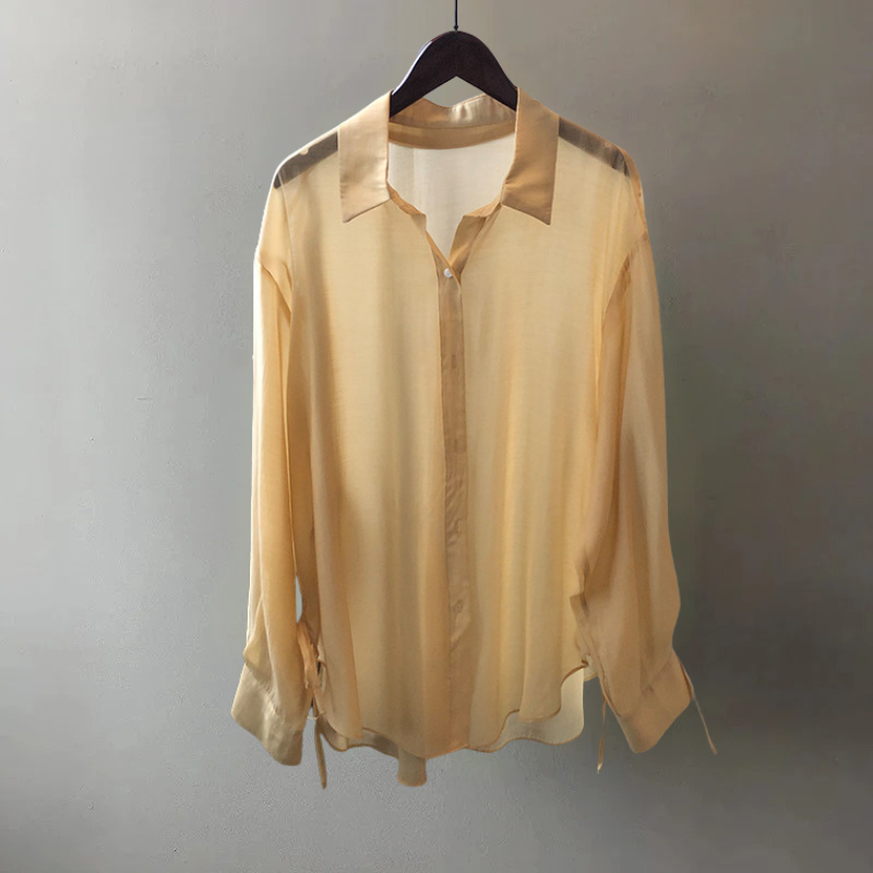 Stylish NOVA women's blouse, a flowy and versatile elegant top for both workwear and casual outings.