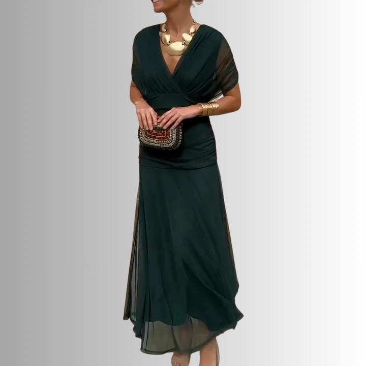 Women's sophisticated off-shoulder maxi dress with elegant draped neckline for special occasions.