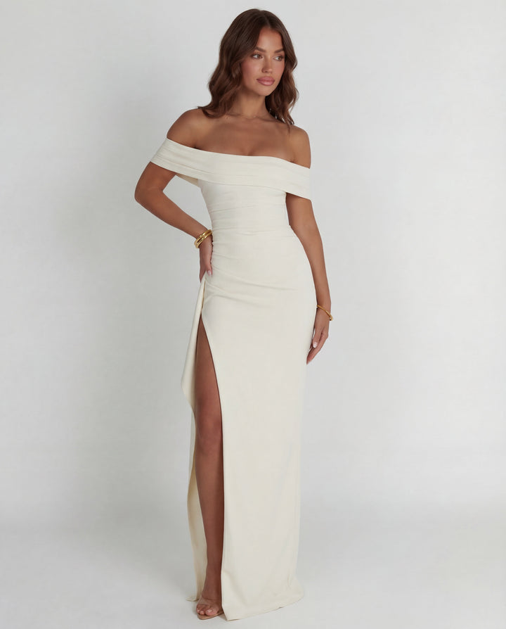 Full-length women's off-shoulder ruched maxi dress. Elegant bodycon evening gown, perfect for formal events.