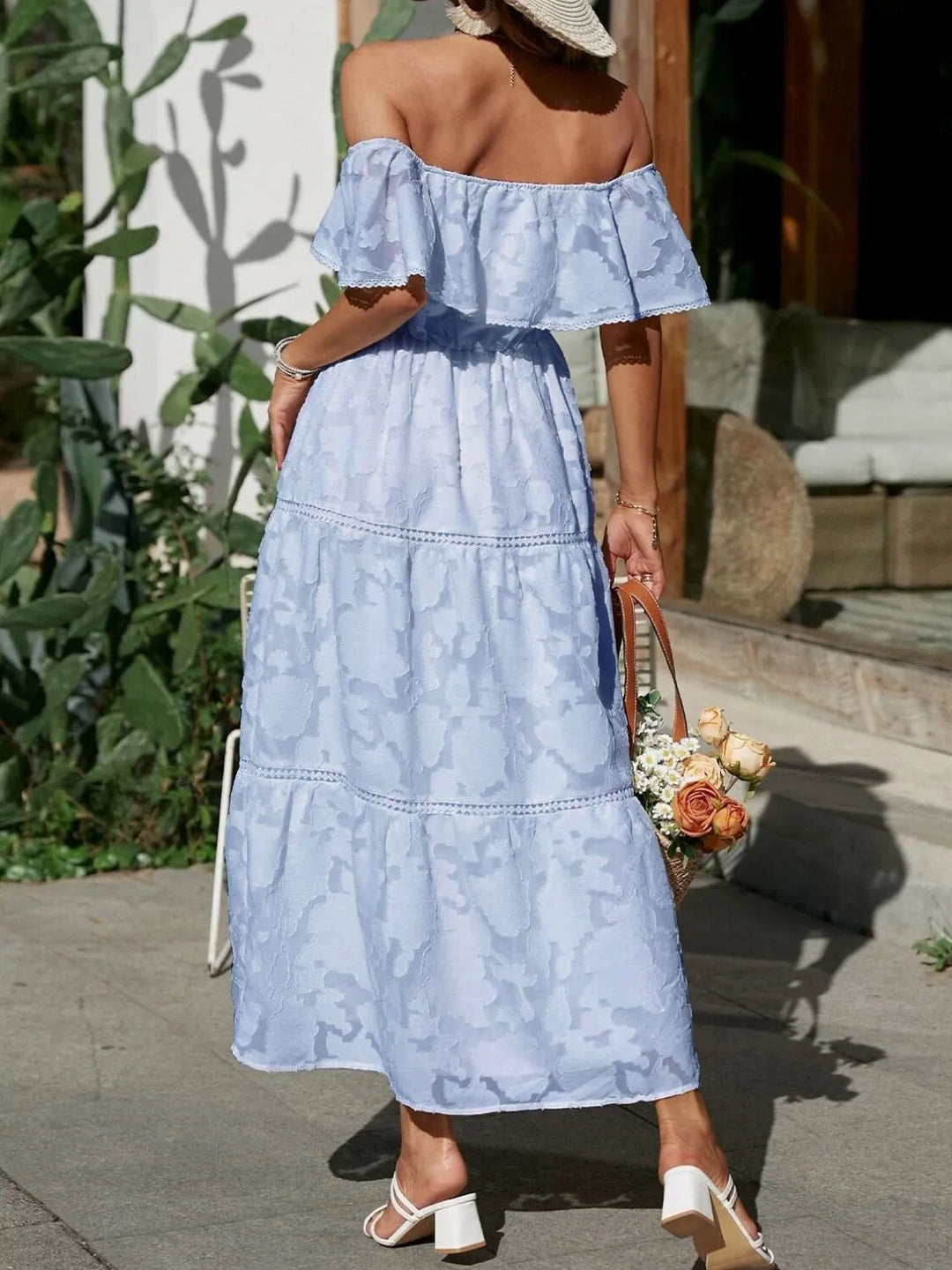 Elegant off-shoulder women's maxi dress with beautiful tiered ruffles, perfect for weddings.