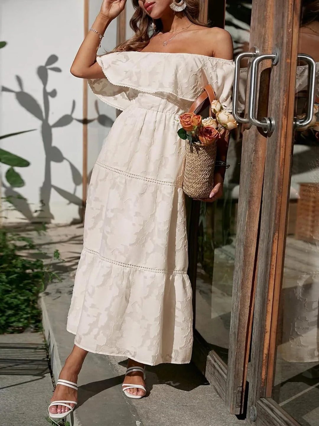 Summer off-shoulder maxi dress with tiered ruffles, perfect for wedding guests and parties.