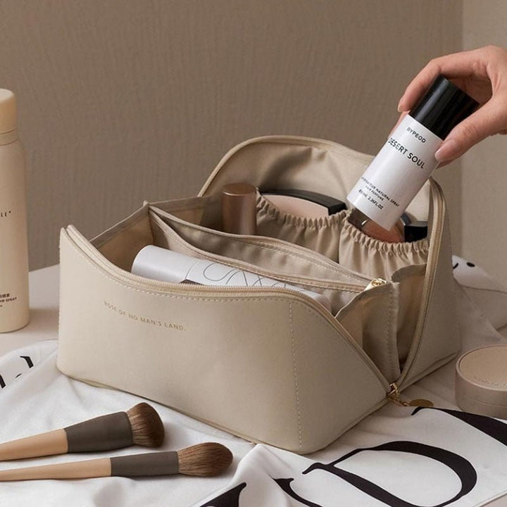 Elegant pink travel makeup organizer bag for women, perfect for cosmetics & beauty essentials on the go.