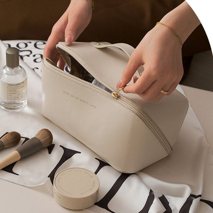 Chic brown portable cosmetic organizer bag, ideal for women's beauty essentials and travel storage.